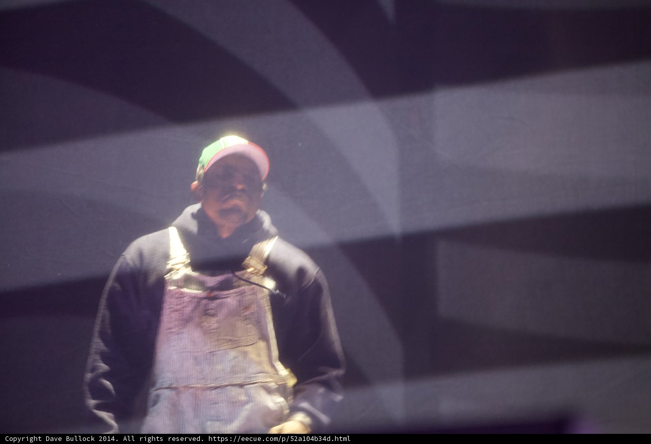 On Stage with Overalls and a Hat