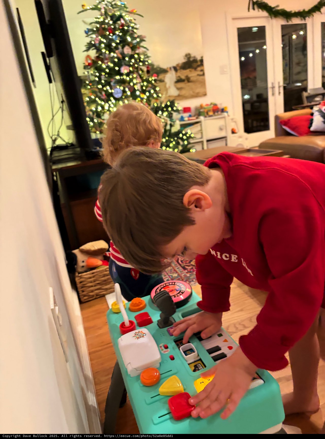 Children Playing with Activity Toy on Christmas Morning