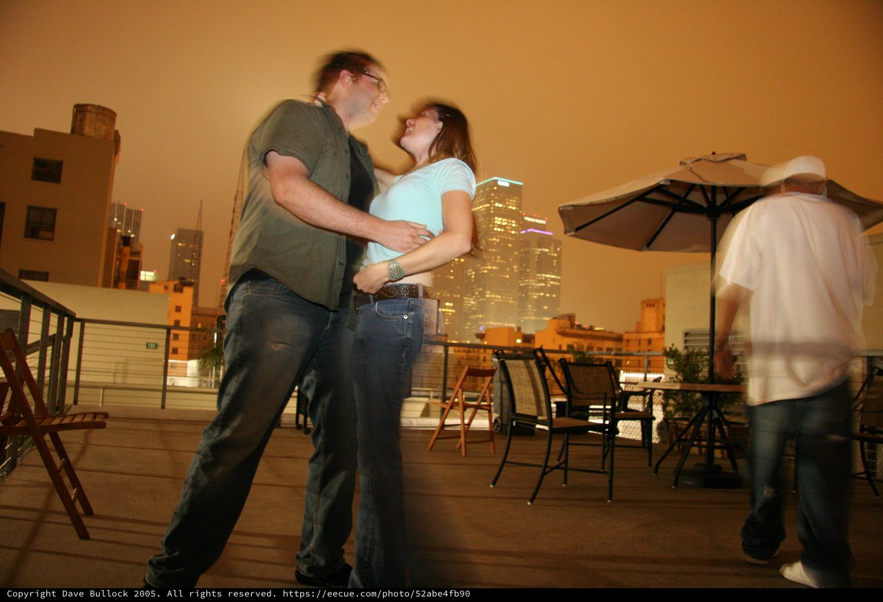 Rooftop Romance Under City Lights at Night