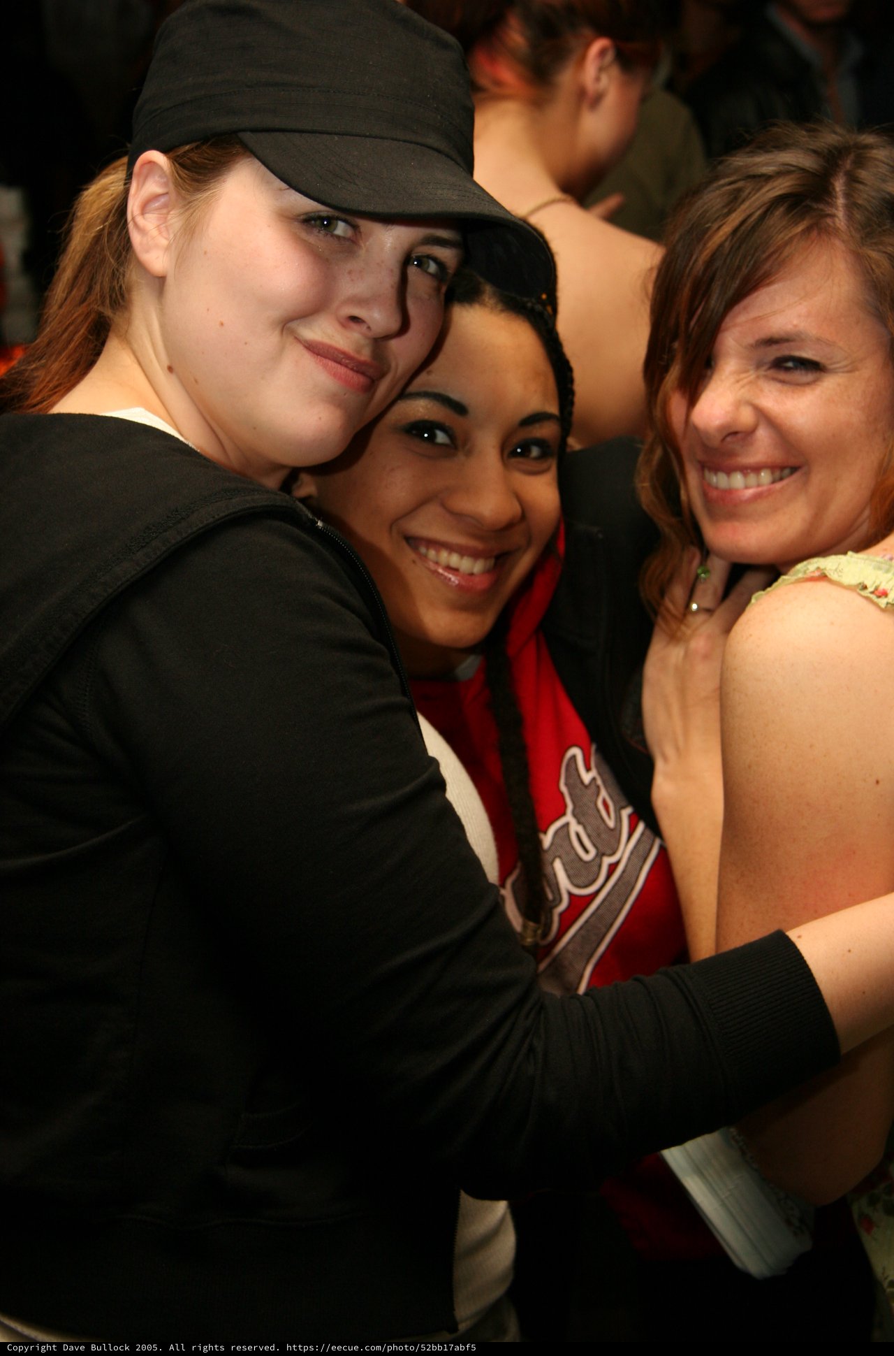 Three Friends Share a Joyful Group Hug
