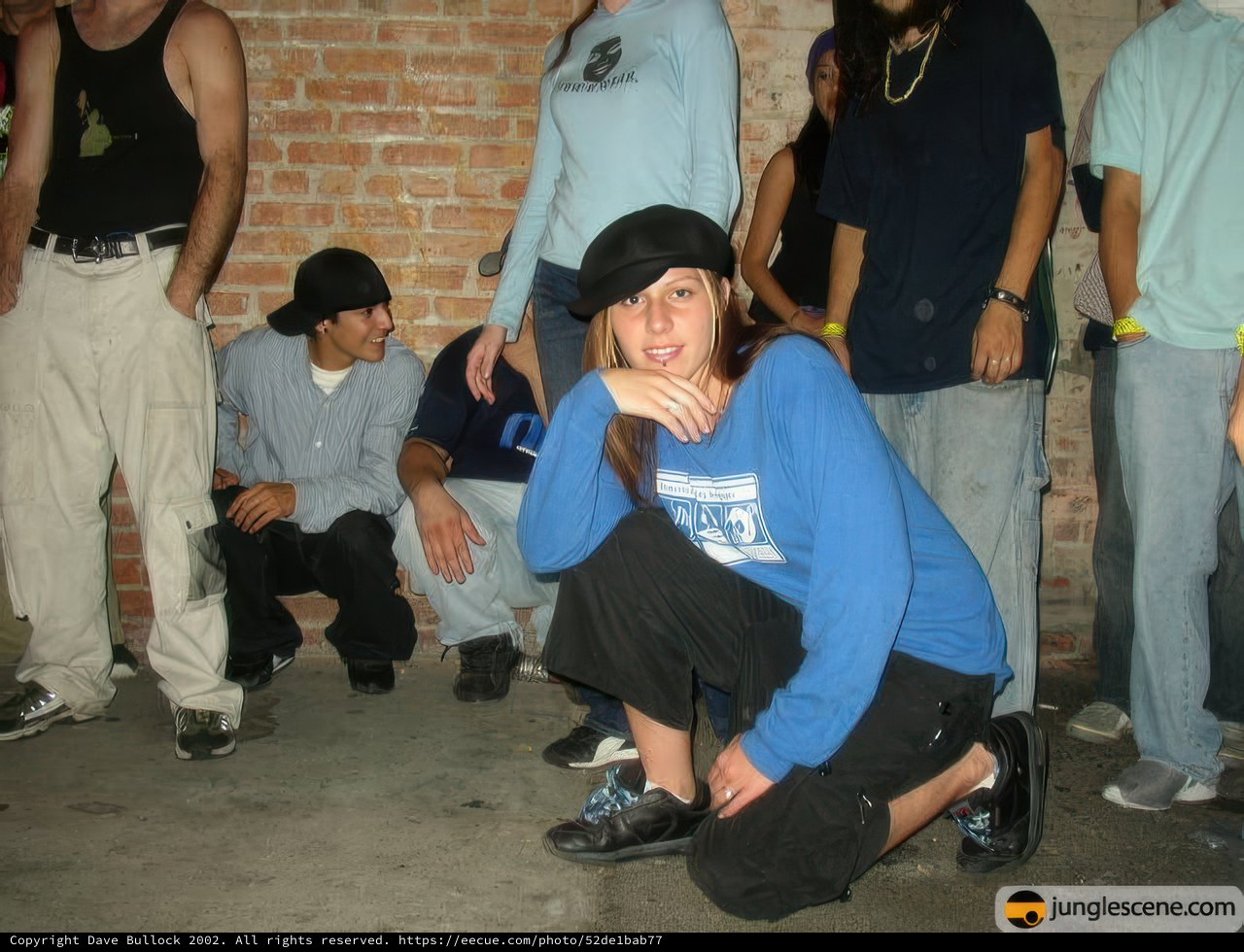 Blue Shirted Woman Dancing in Sneakers