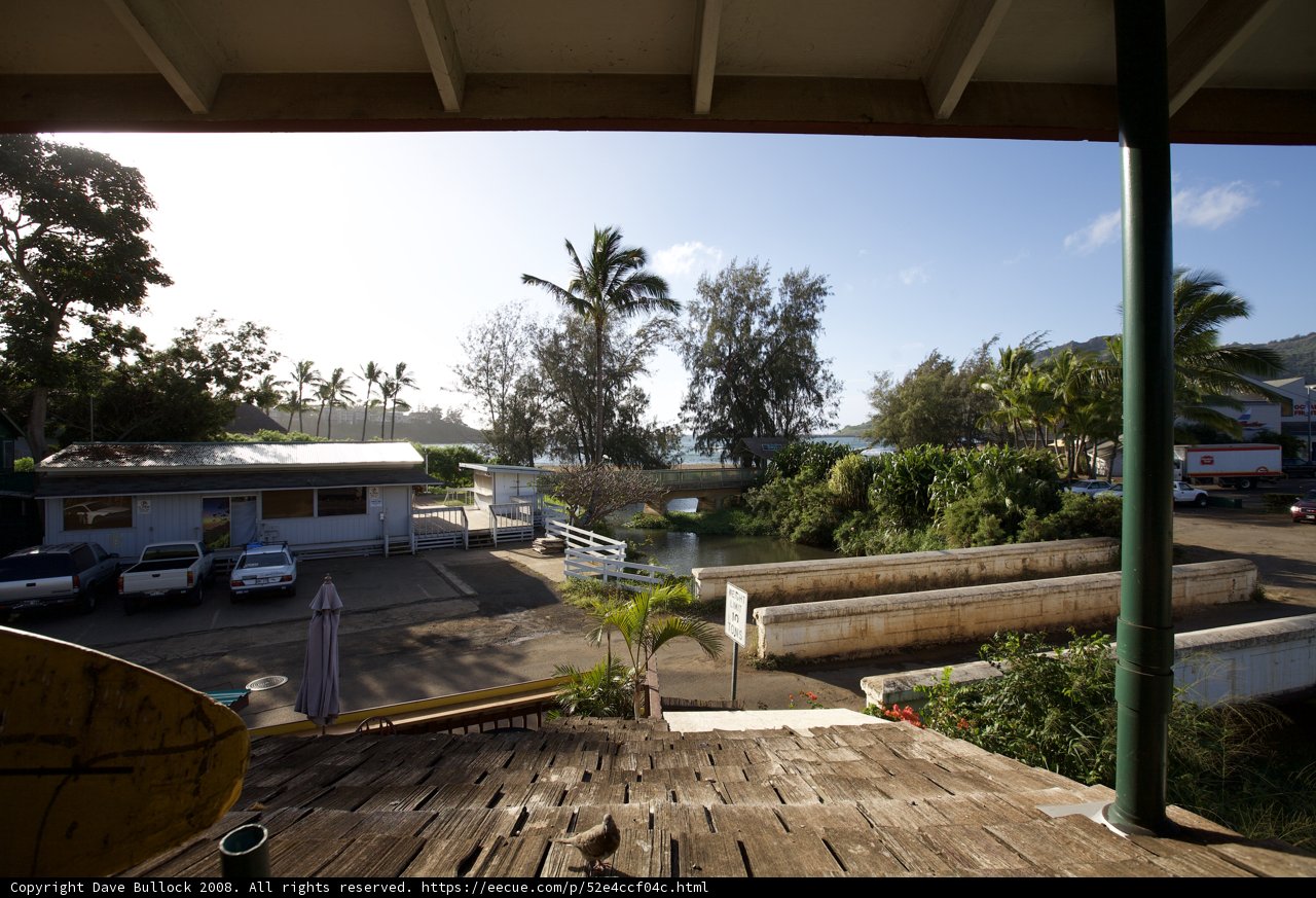 A Breathtaking View of the Beach from a Rooftop Porch