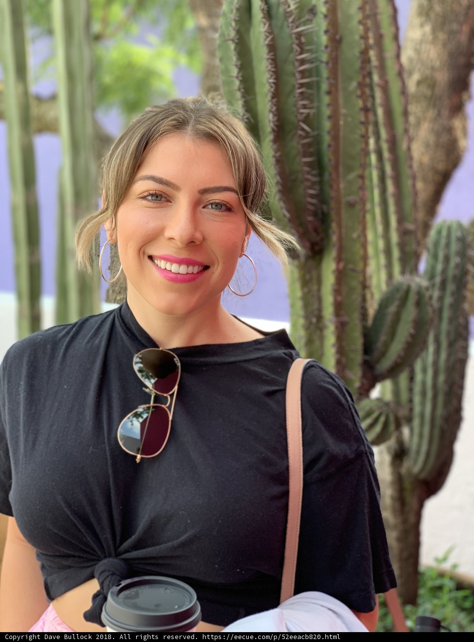 Smiling Woman with Cup and Cacti