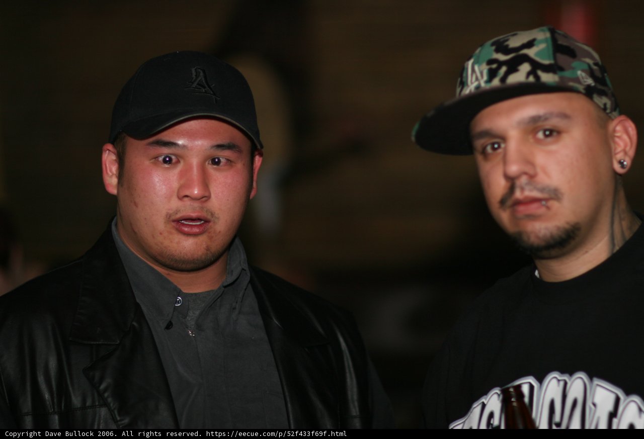 Two Men in Baseball Caps and Jackets