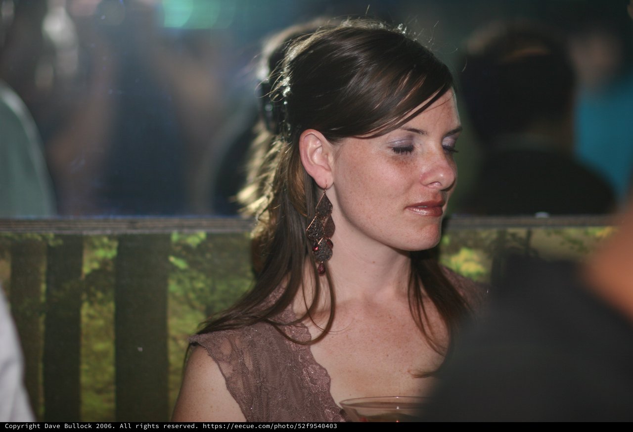 Pensive Woman at Evening Social Gathering