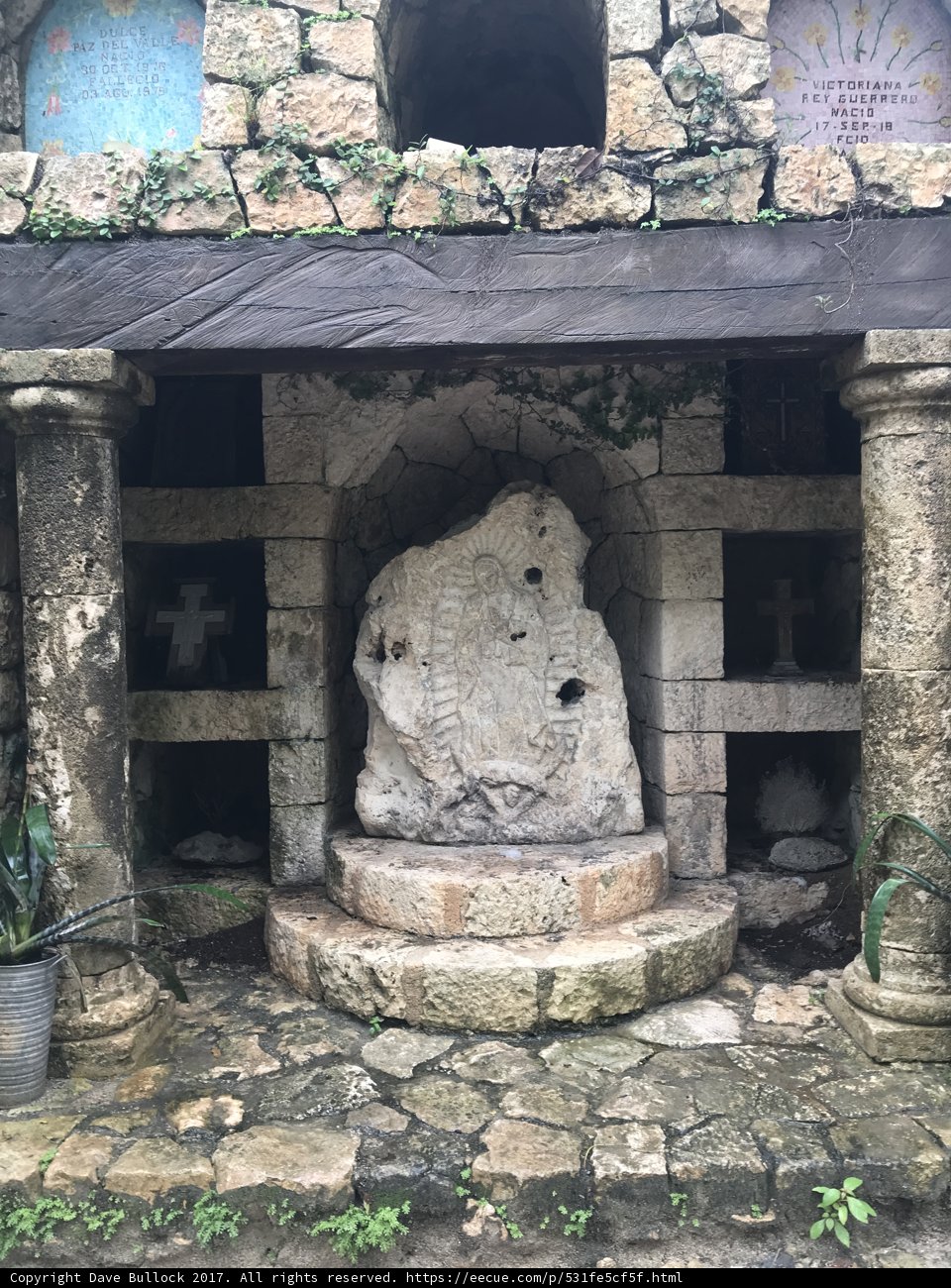 Stone Statue in Front of Ancient Building