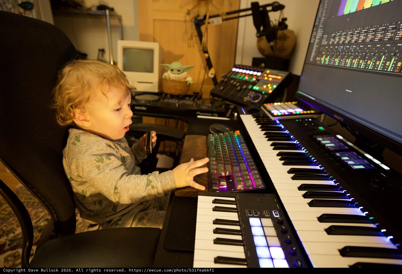 Young Child Exploring Music Production Studio Setup