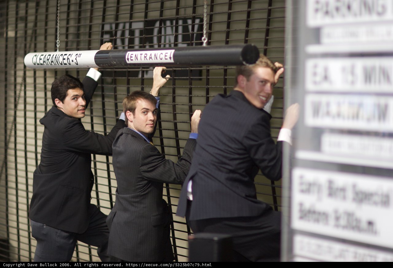 Three Men in Suits Strike a Pose