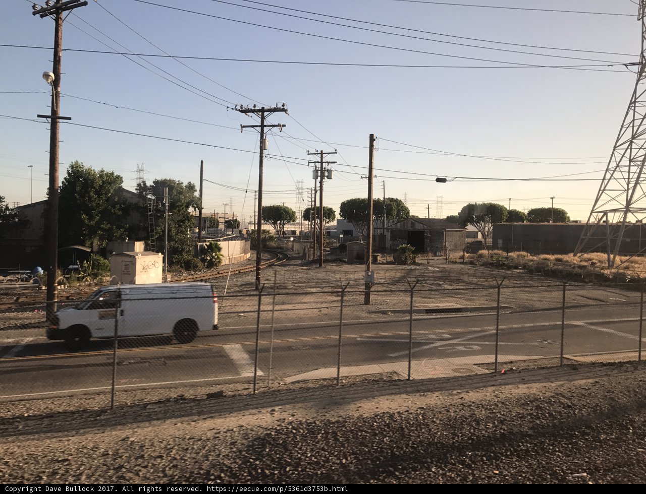 Parked Van in Front of Fence