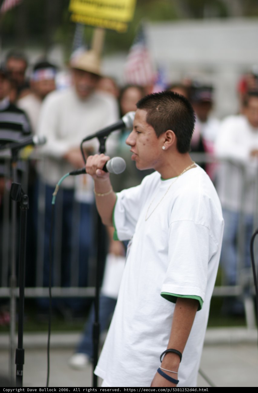 Protester Addresses the Crowd with Two Microphones