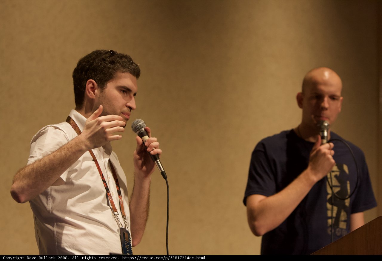 Two Men Entertain the Audience with Dual Microphones