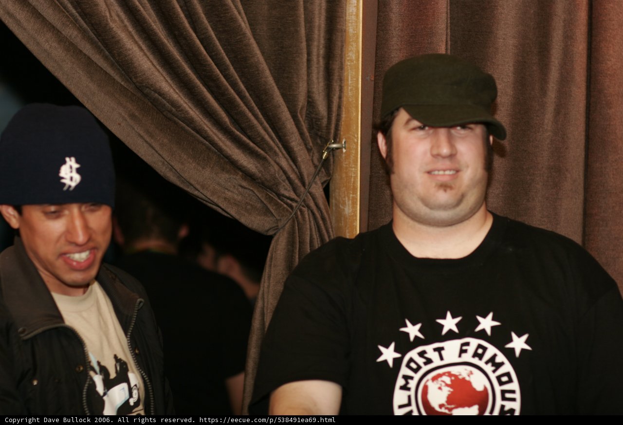 Man in Black Shirt and Baseball Cap