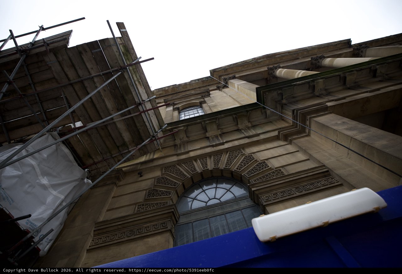 Upward View of Classical Stone Architecture Under Renovation