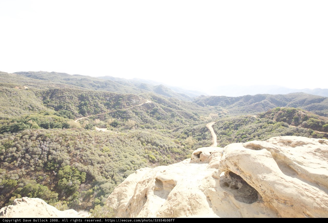 Cliffside View of Majestic Mountain Range