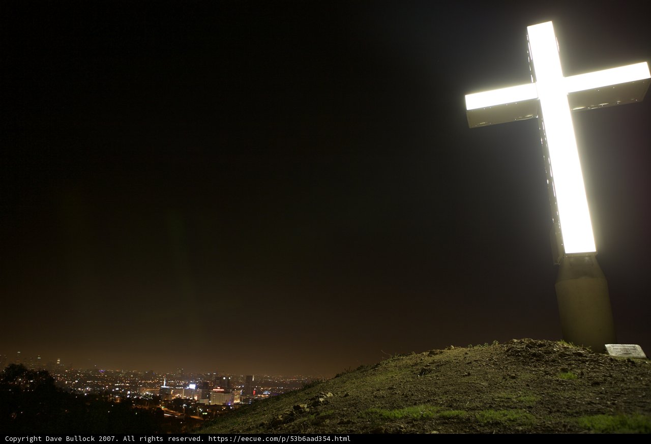 Illuminated Cross on Hilltop