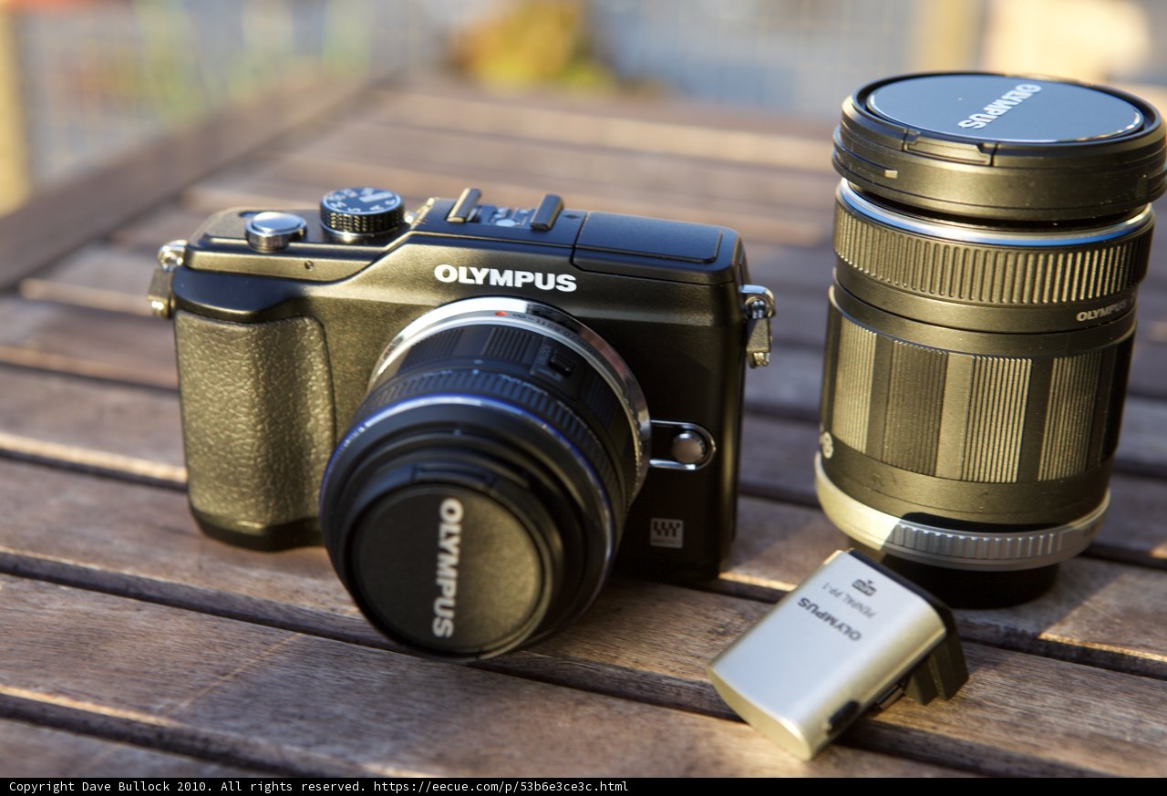Camera Gear on Wooden Table