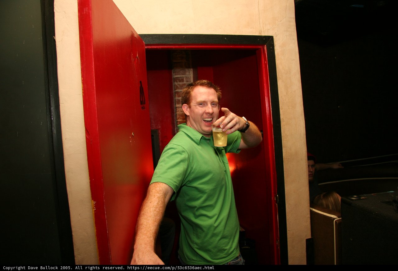Green Shirt Guy Enjoys a Pint at the Pub