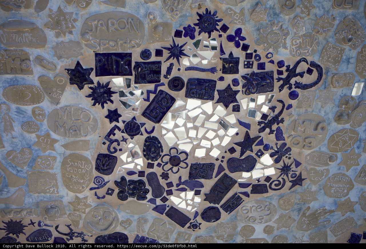 Blue and White Mosaic Star on Walkway Wall