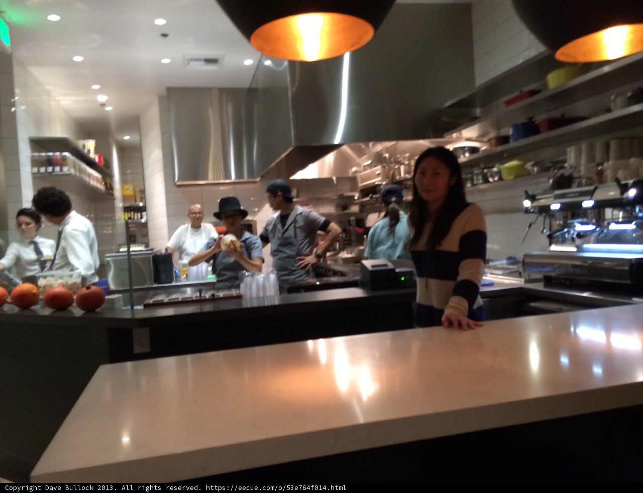 Group gathering for a meal at a bustling restaurant