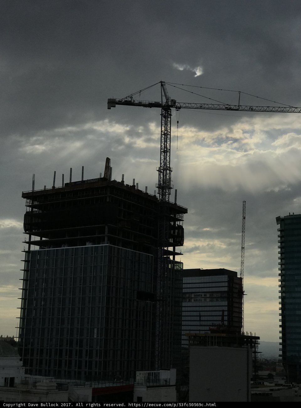 Construction Crane Towering over Office Building