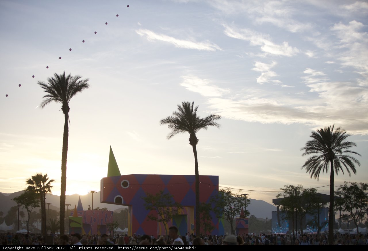 Colorful Building and Palm Trees with Kite Flying