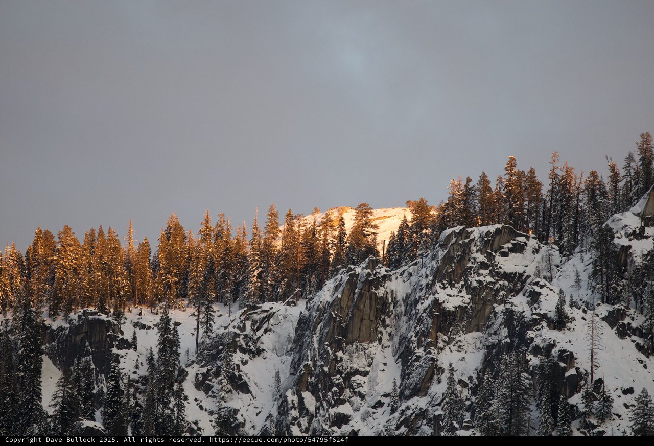 Golden Hour Illuminating Snow-Covered Yosemite Cliffs