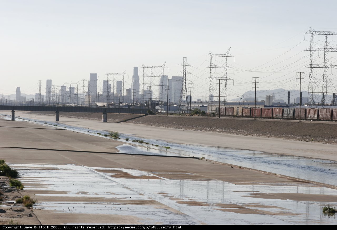 Urban river and electric transmission tower