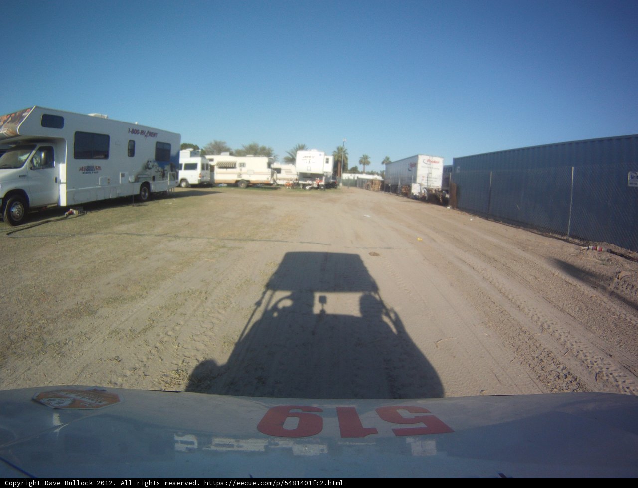 Tranquil Dirt Road with Parked Truck