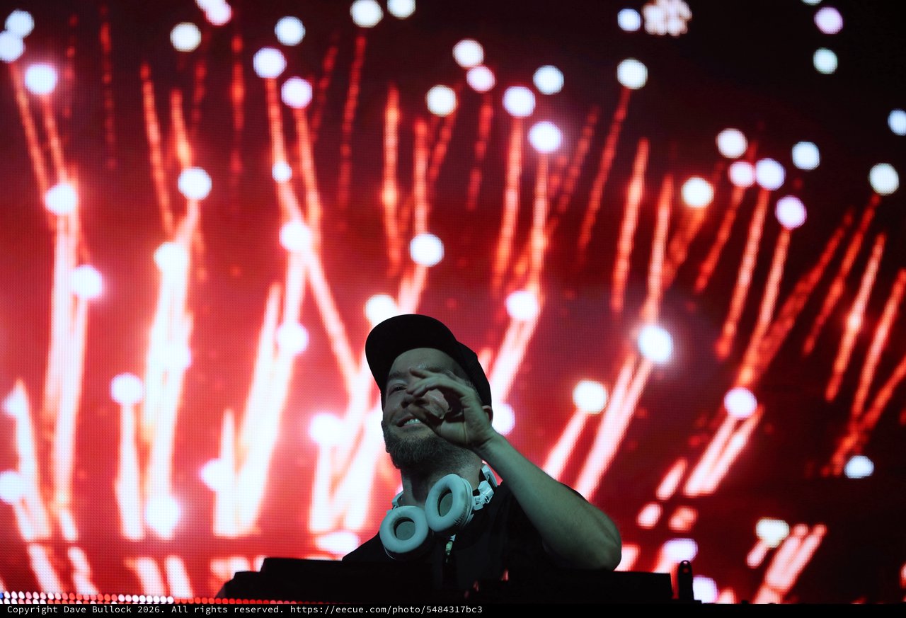 DJ Performs Under Blazing Red Festival Lights