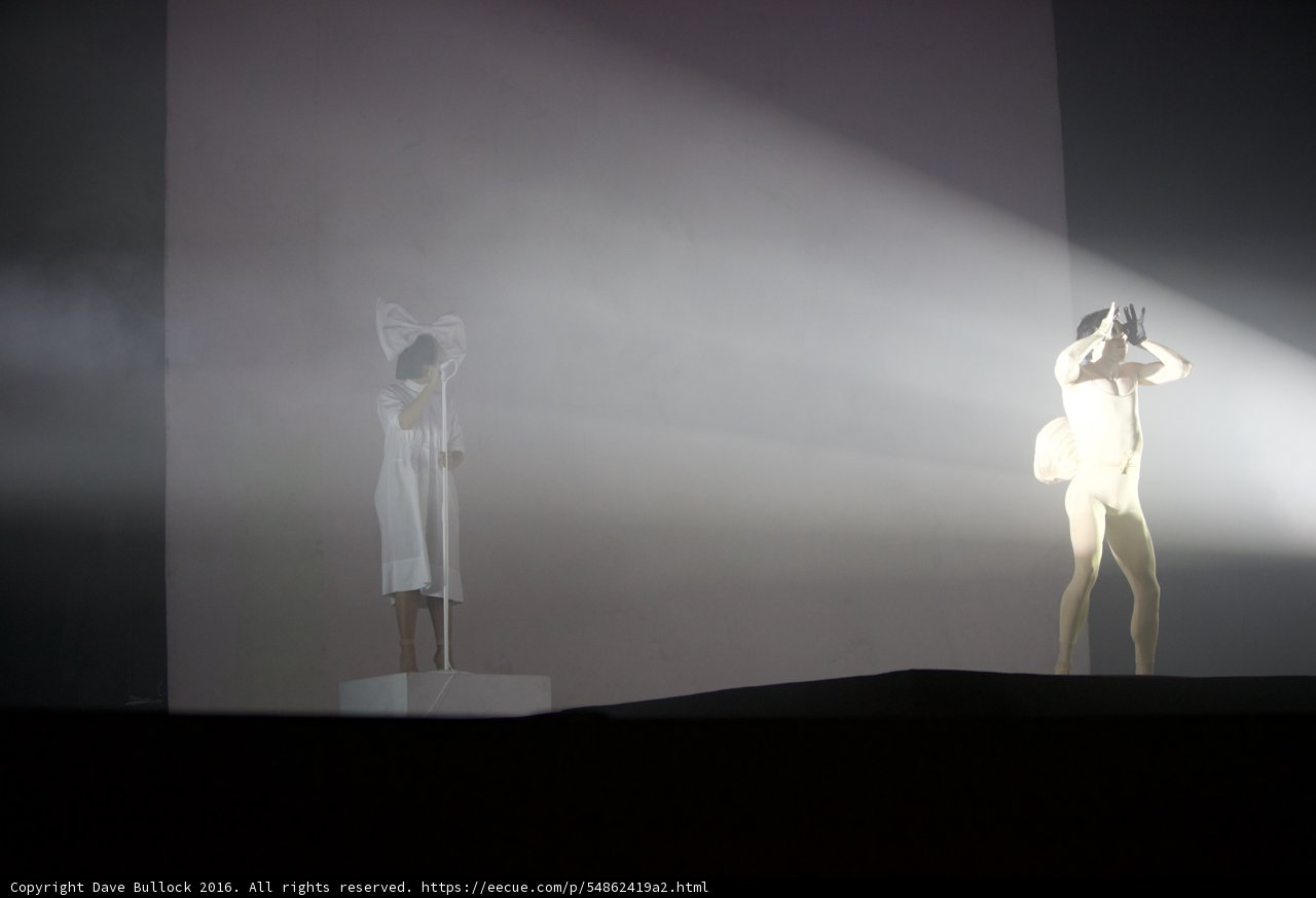 Spotlight on the White-Clothed Man