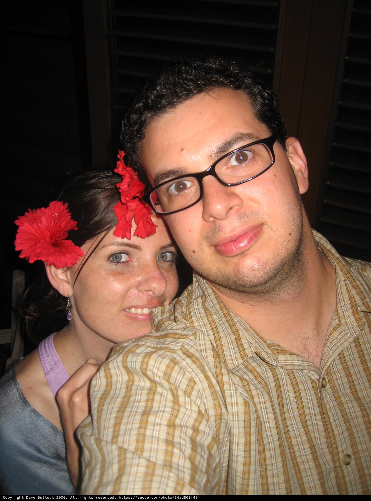 Couple Poses Together at Tropical Evening Gathering