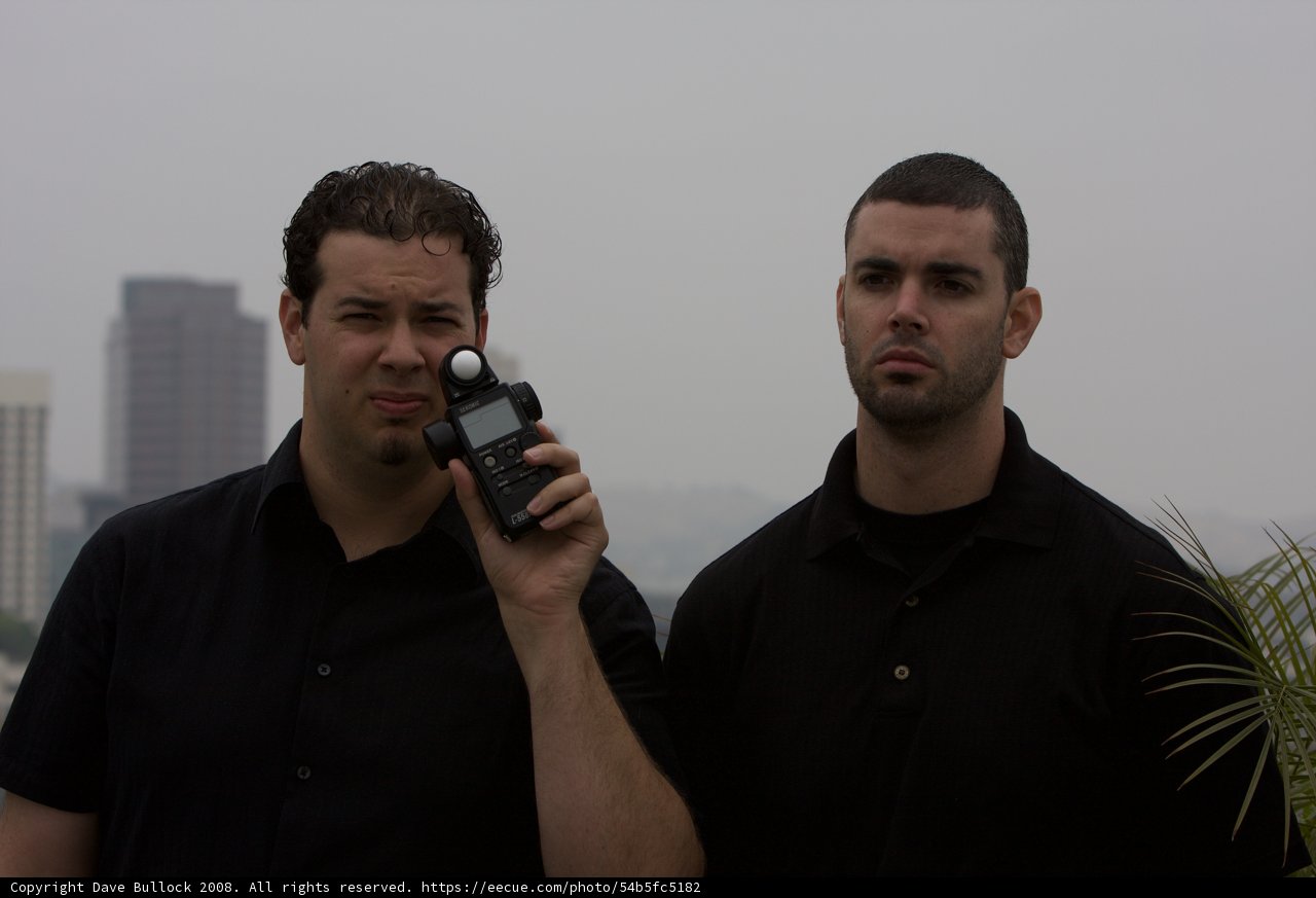 Two Men in Front of Building