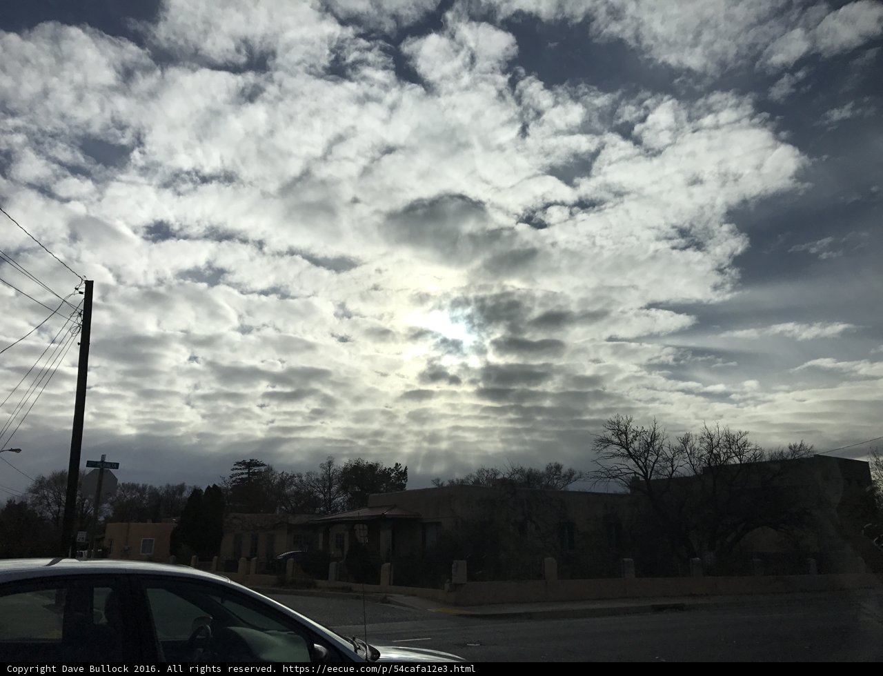 Parked Car under a Moody Sky