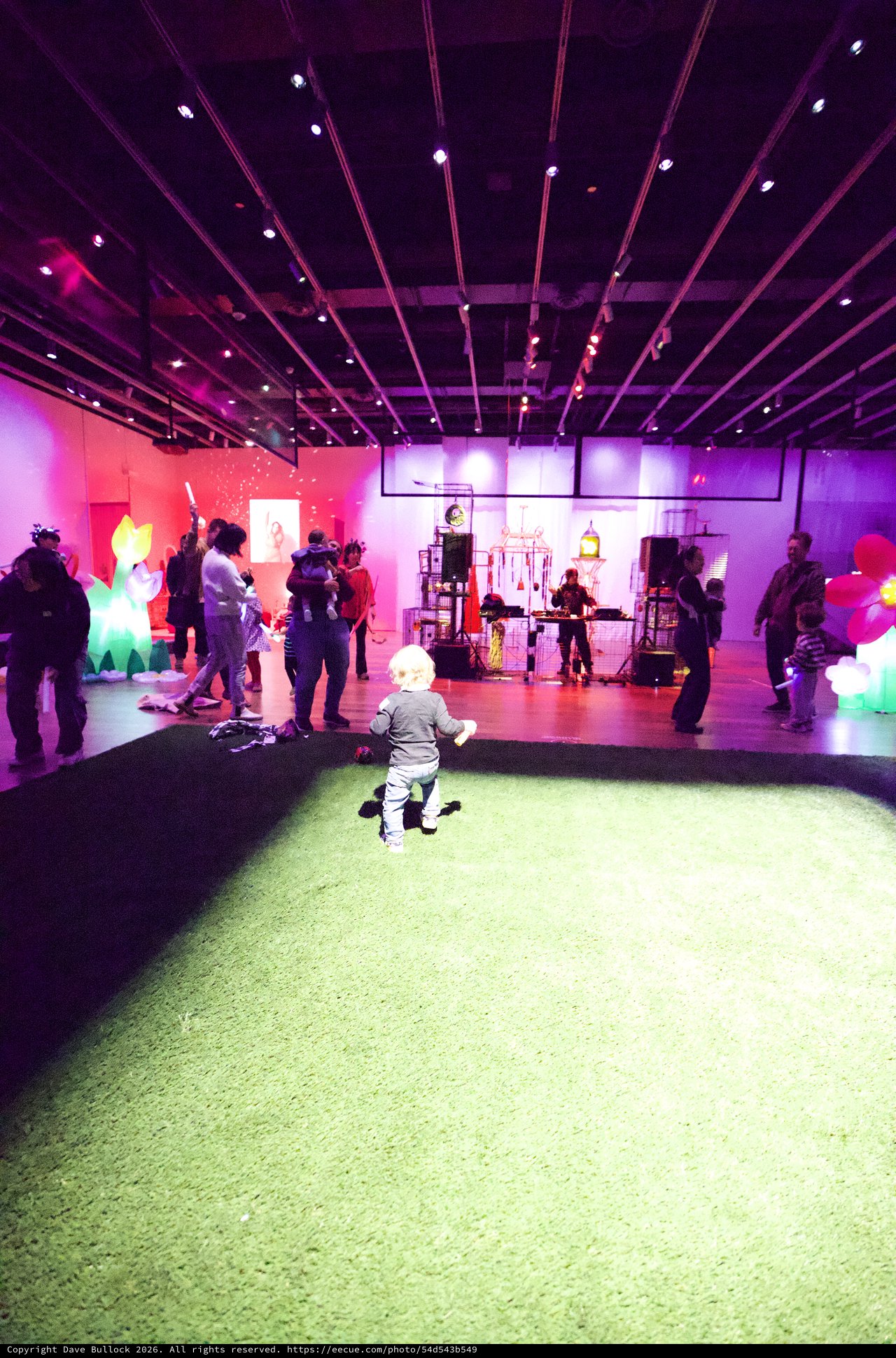 Child Playing at Vibrant Baby Rave Exhibition