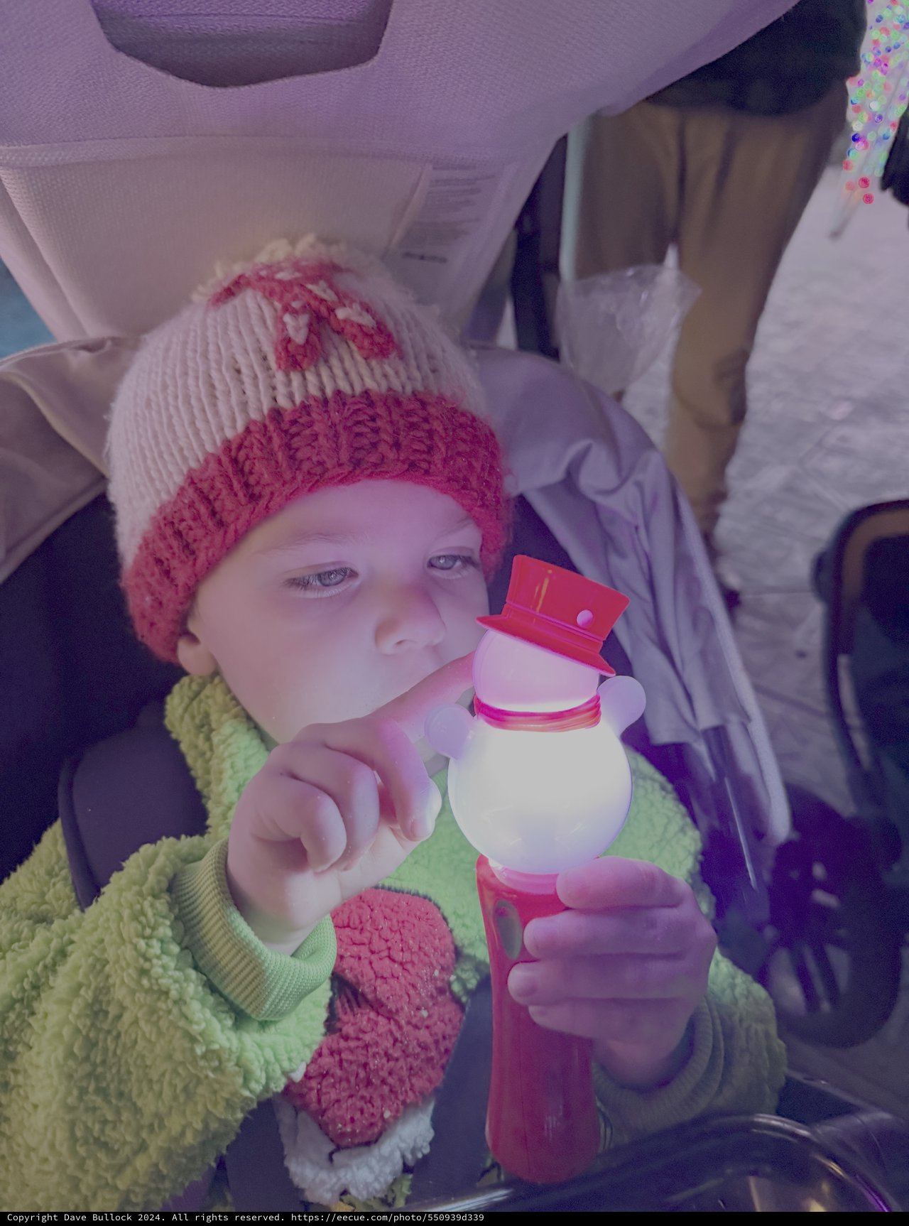 Child with Snowman Toy in Winter Car
