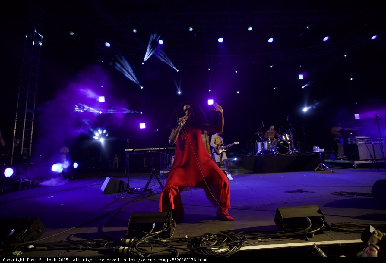 Solange Crouching Dynamic Pose Red Dress Stage
