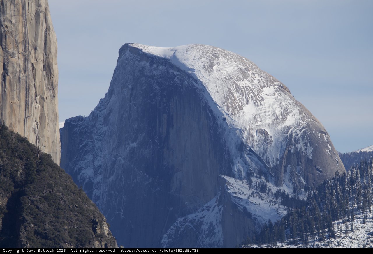 Half Dome's Snow-Covered Granite Face in Winter