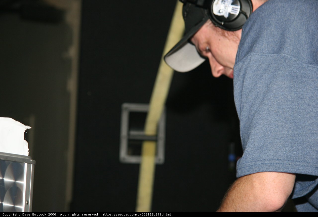Blue-Shirted Man with Baseball Cap