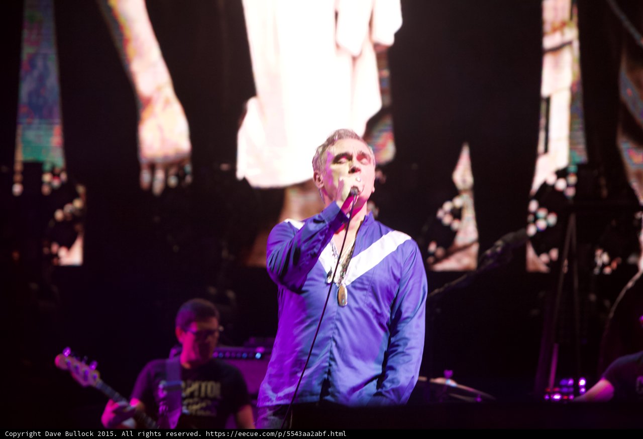 Morrissey Singing Blue Shirt Necklaces Bassist Glasses Capitol Tee Smiths Dangling Hands Screen Drummer