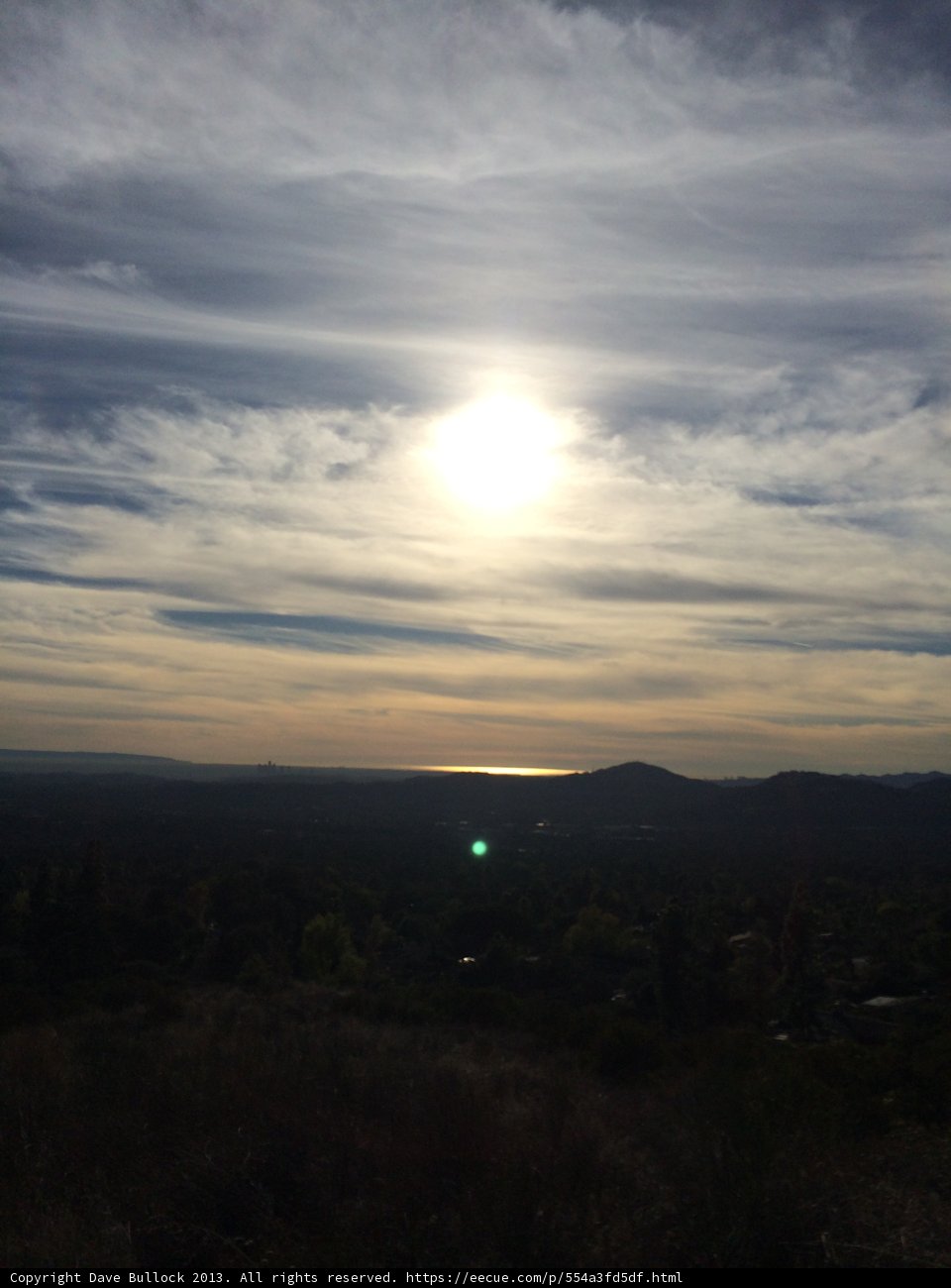 Glowing Sun Peeking Through Clouds