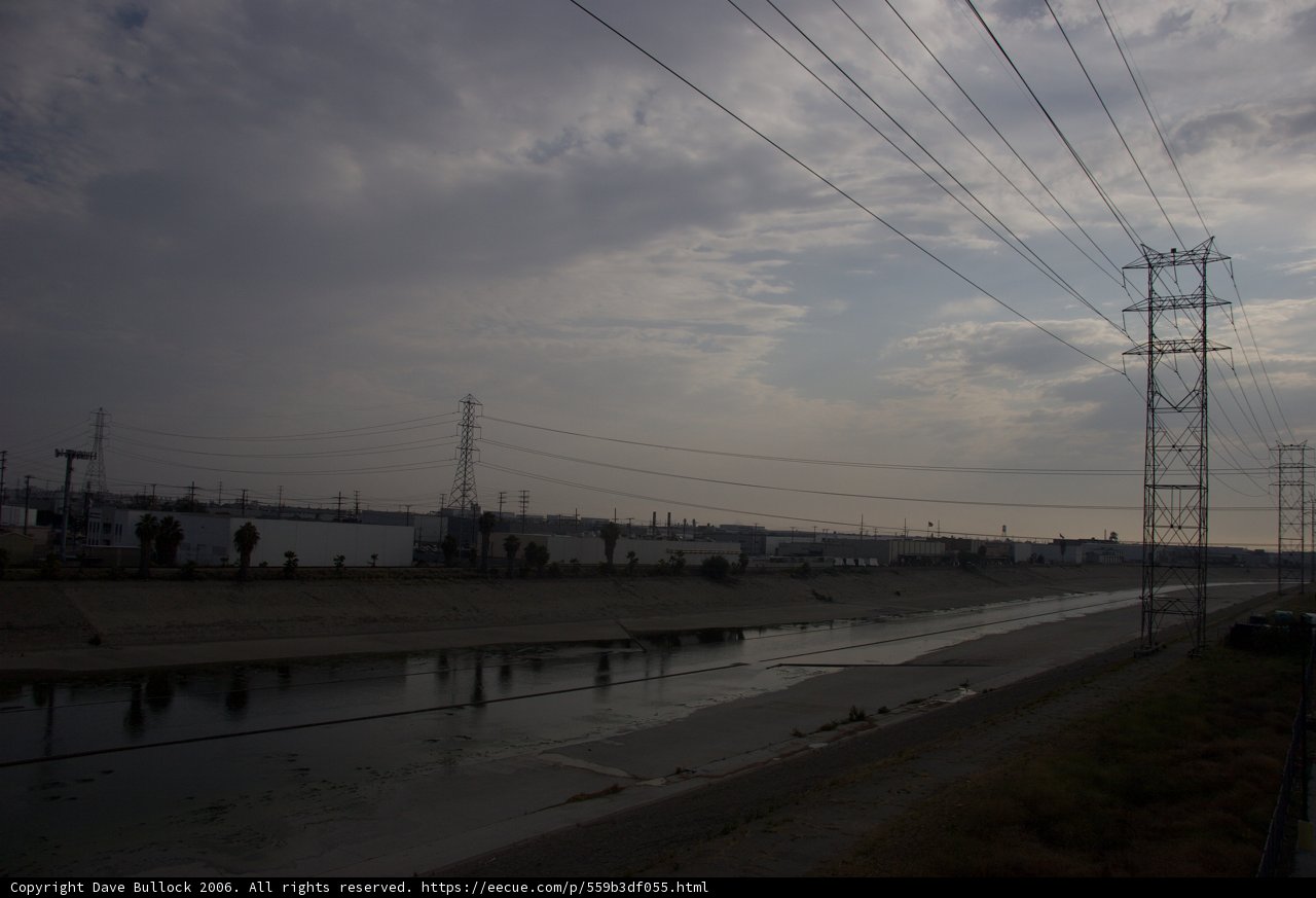 Power Lines and a Building Along the River