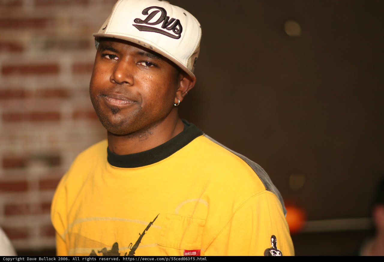 Yellow-shirted Steve J with Hardhat and Baseball Cap