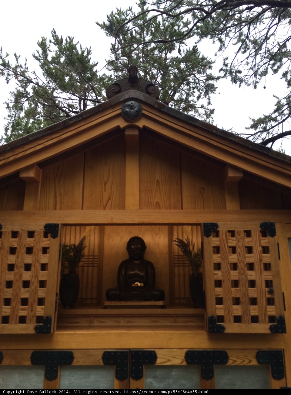 Buddha statue on wooden building