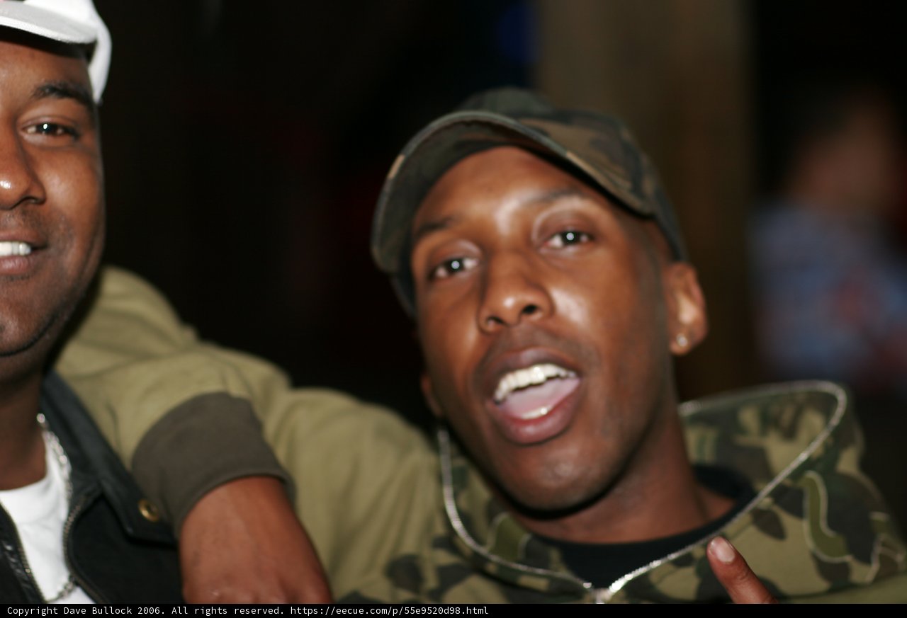 Two Men Strike a Pose in their Baseball Caps