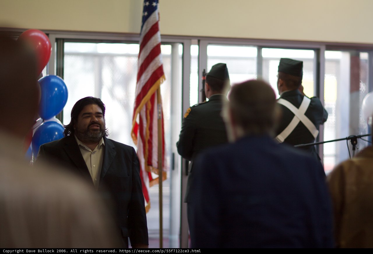 Man in a Suit Addressing a Crowd