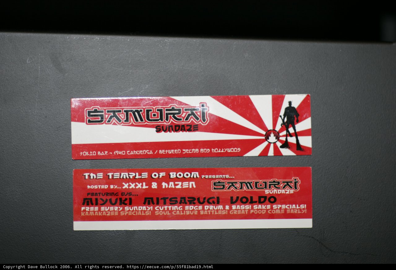Red Sticker on Black Surface