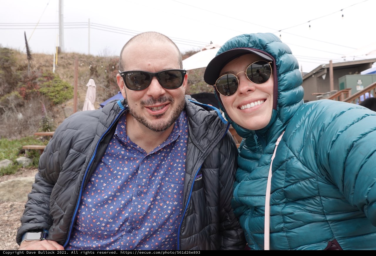 Couple in Puffy Jackets Enjoying Outdoor Adventure