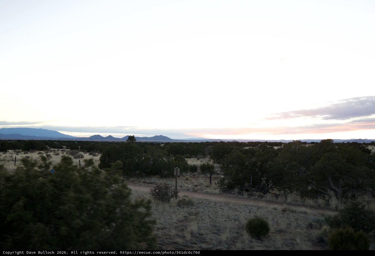 Desert Twilight Over Distant Mountain Ranges