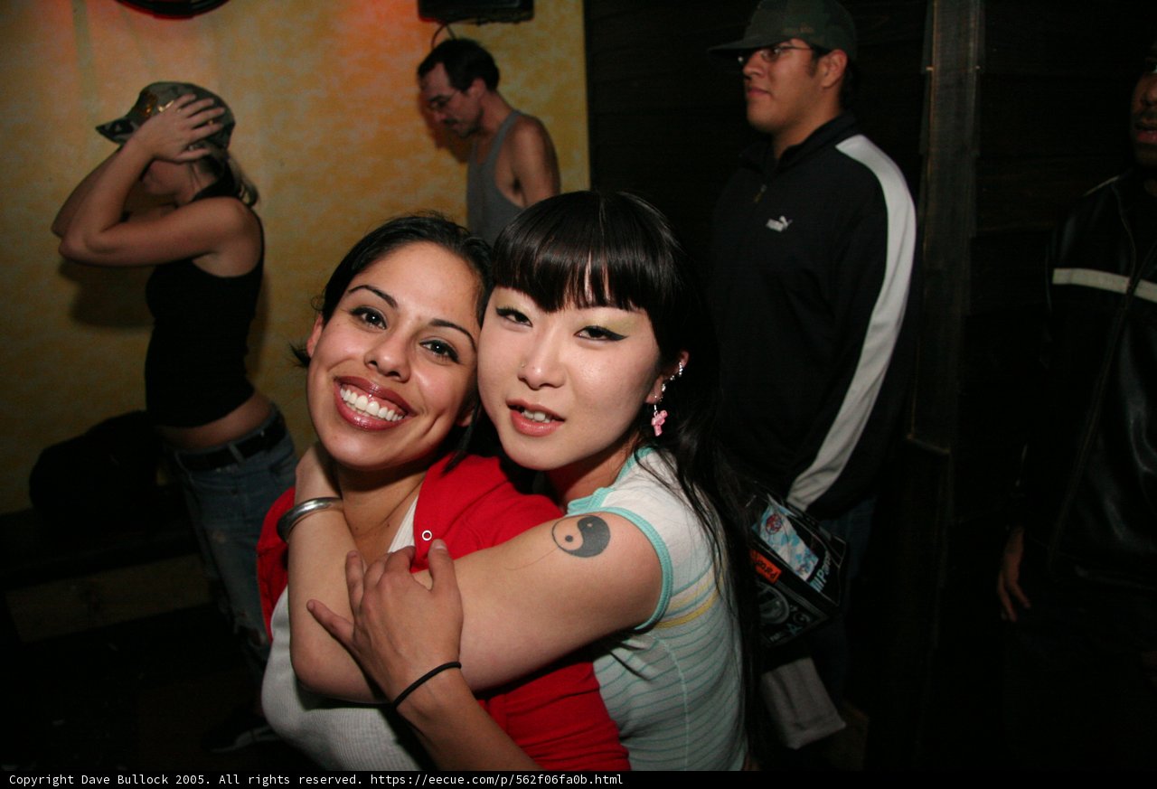 Red Shirted Woman in the Night Club Crowd