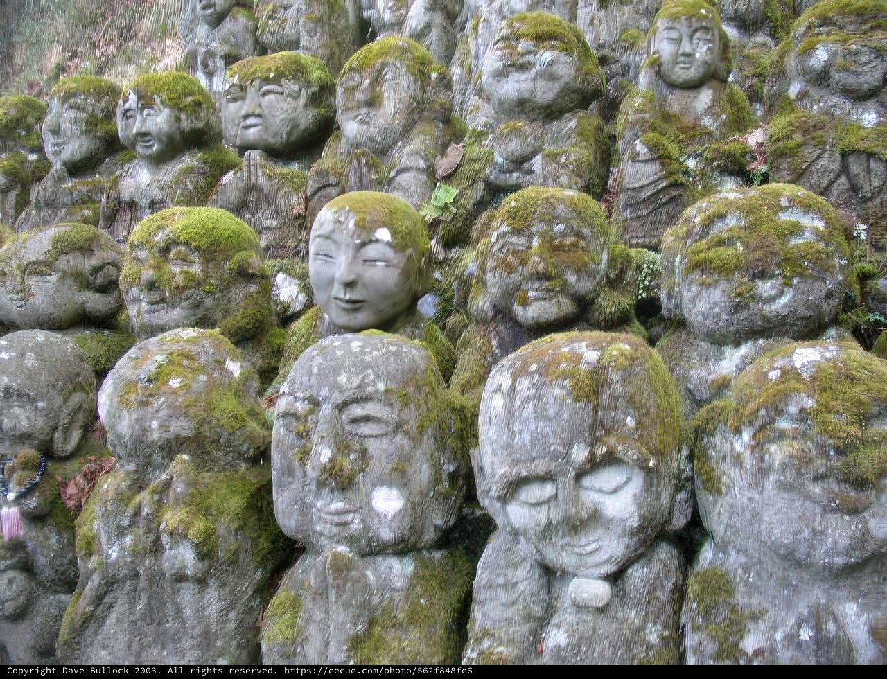 Moss-Covered Stone Statues at Kyoto City Hall